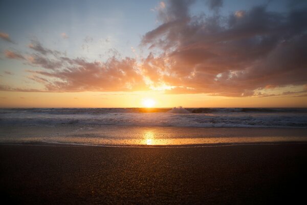 Beautiful sunset on the background of the sea