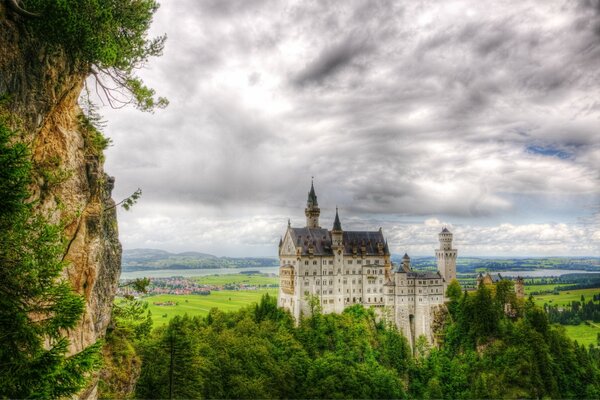 Neuschwanstein Castle surrounded by lush greenery