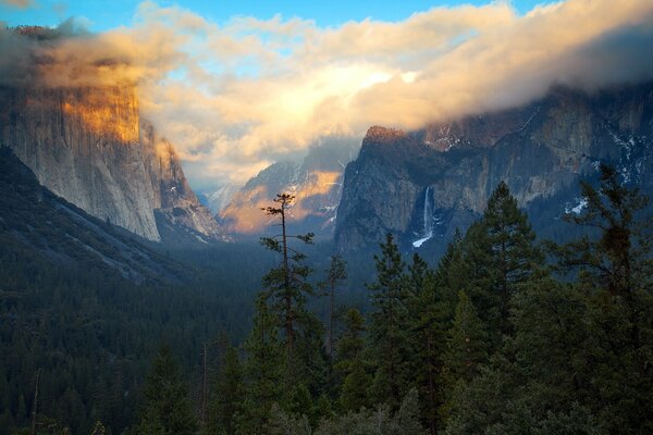 Mountains. Forest. Sky. Waterfalls