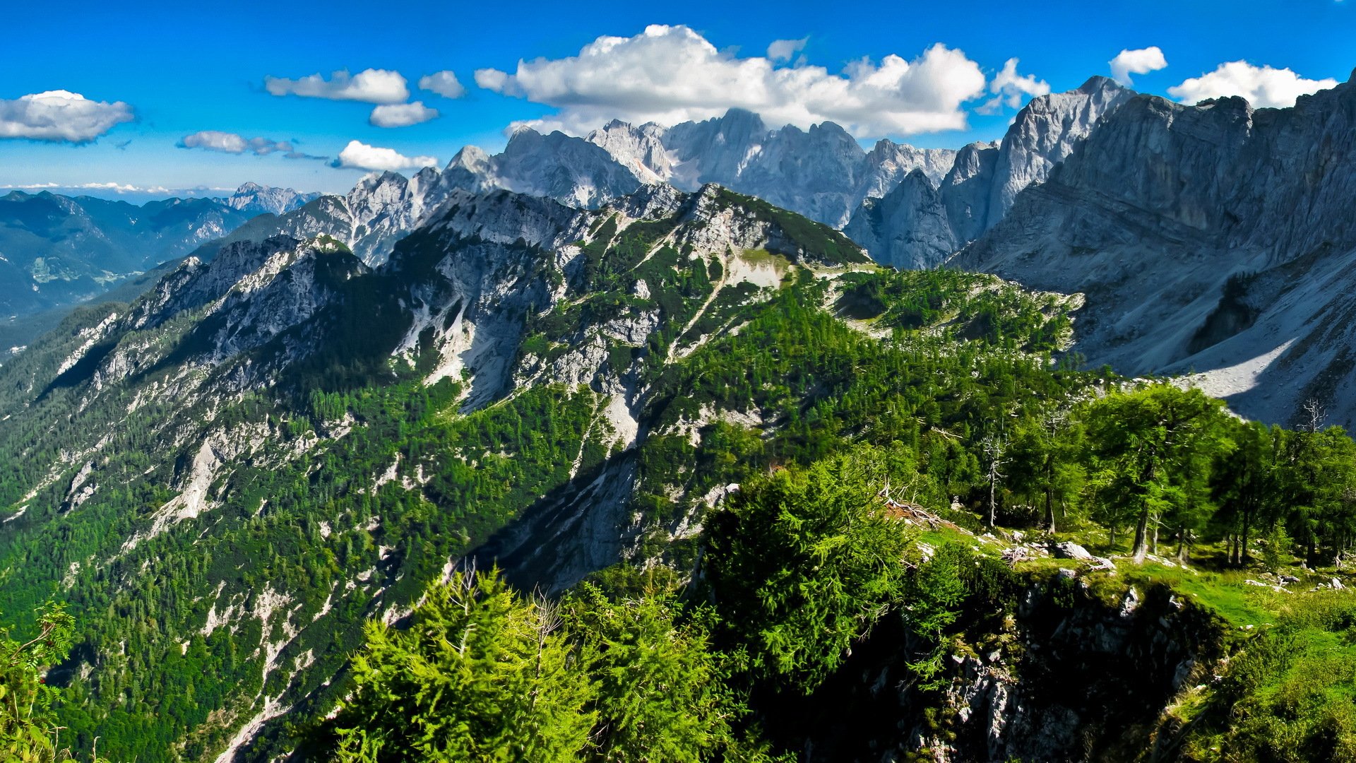 ummer mountain rock slope snow sky clouds nature landscape