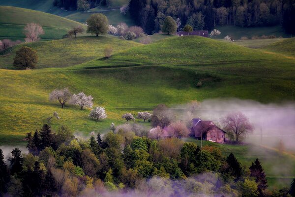 Fog over a village with hills