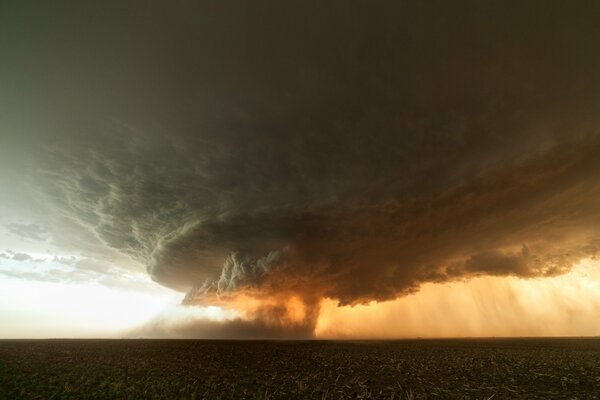 Spectacular view of a tornado in a field in Texas