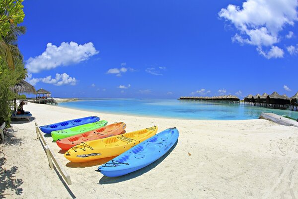 Sandy beach with colorful boats