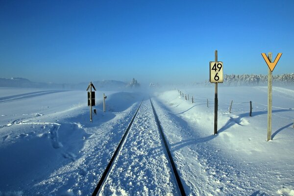 Winter railway with signs