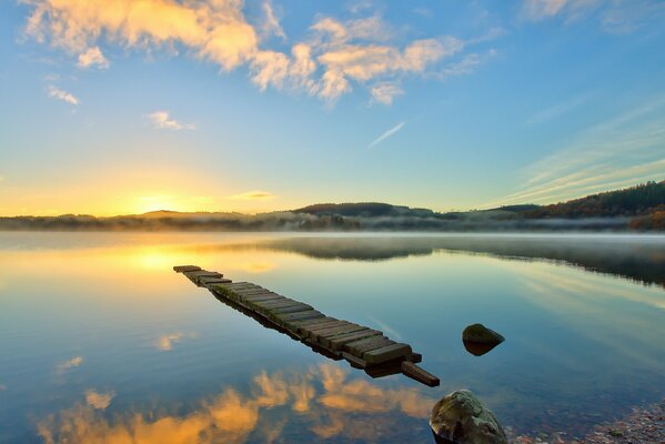 Lake at dawn in the fog