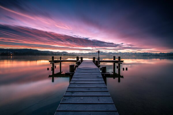 Morning dawn over a wooden bridge