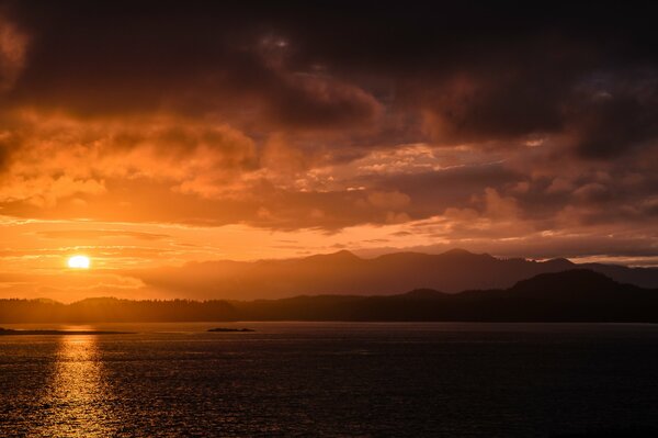 Sunset, the rays of which are reflected in the sea