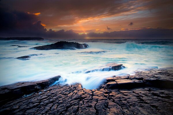 The West coast of Ireland in stormy weather in autumn in the rays of the setting sun