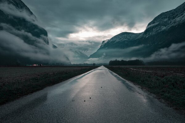 Mountain road connecting with clouds