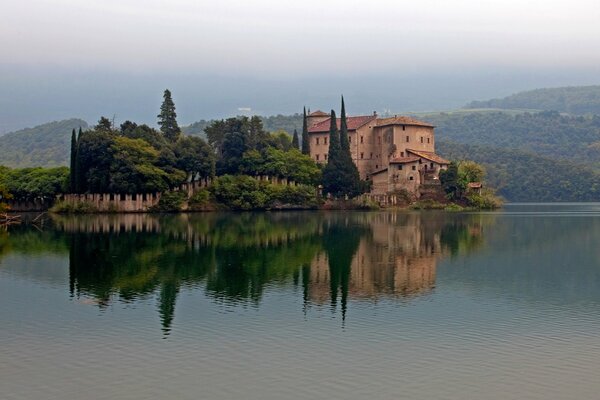 An old castle on the island. Lake surface