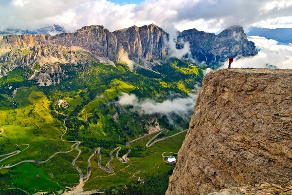 A lonely man on top of a mountain. Italy, South Tyrol