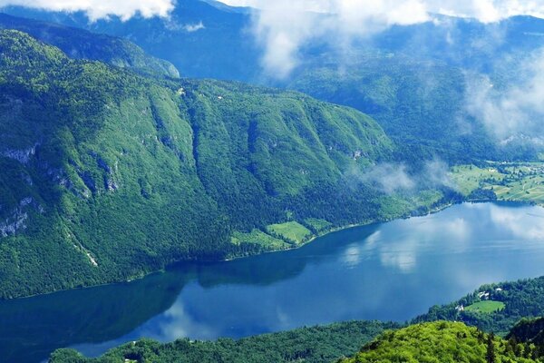 Slovenia. Lake in the mountains. Cloud reflections