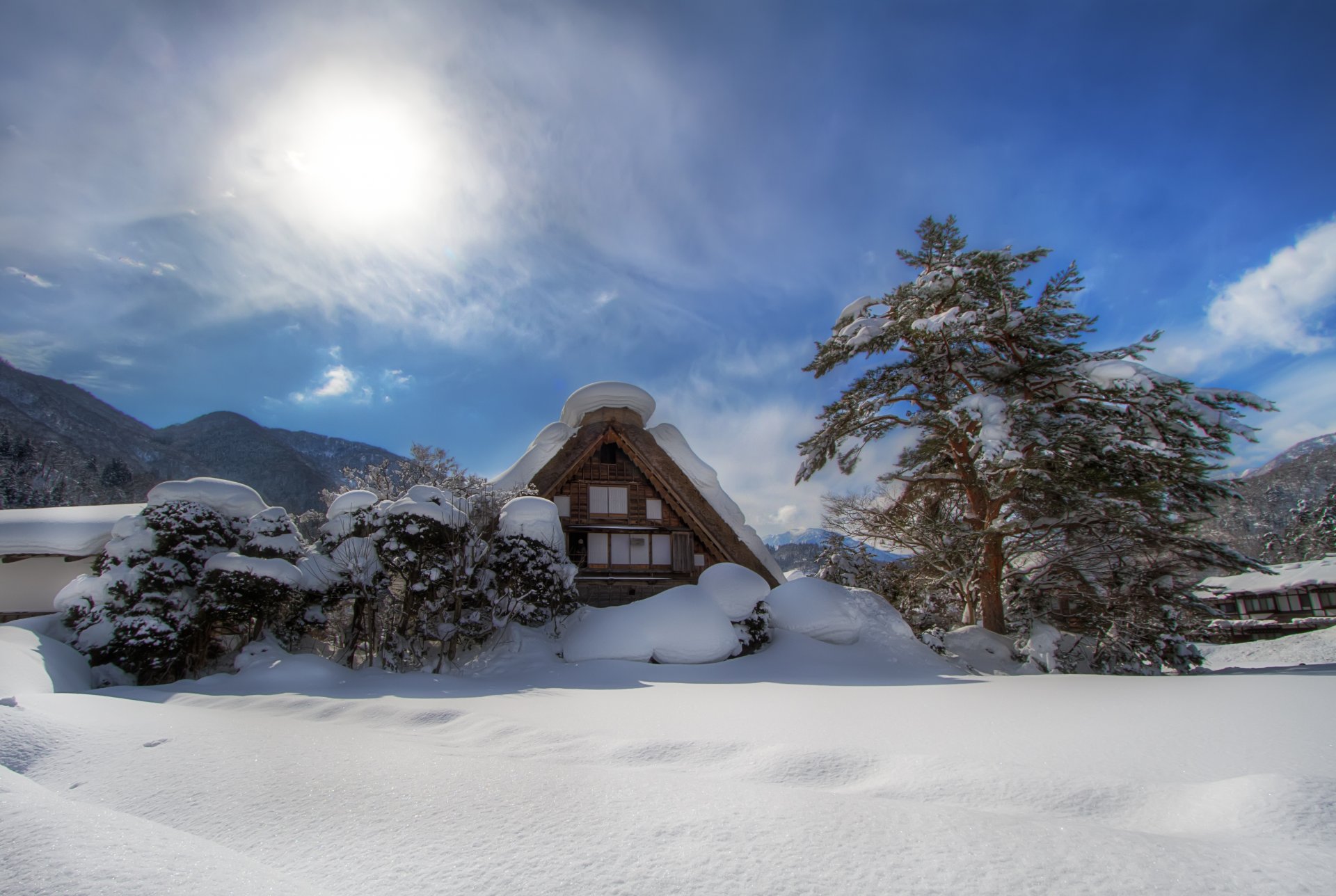 mountain valley tree bush house snow winter sun cloud