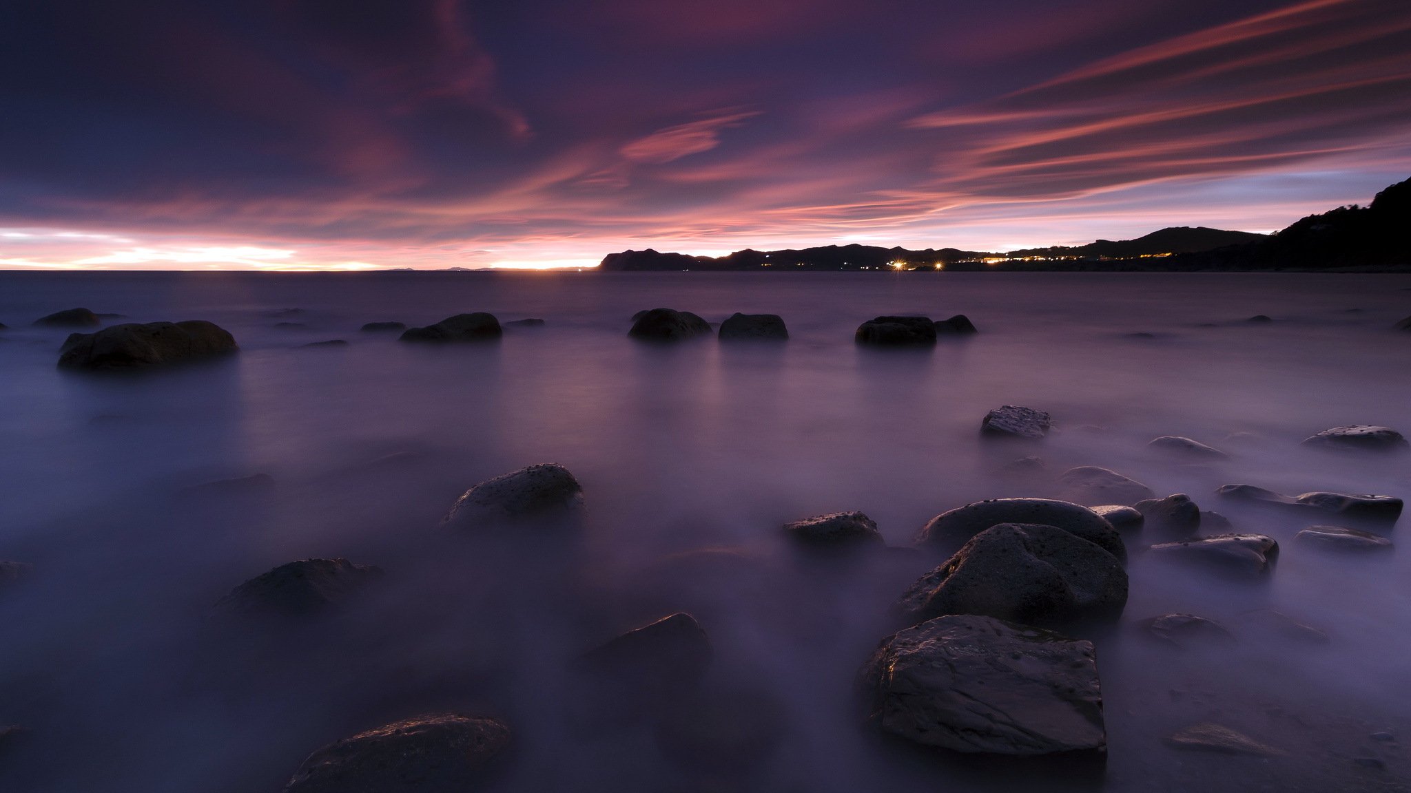 coucher de soleil mer pierres