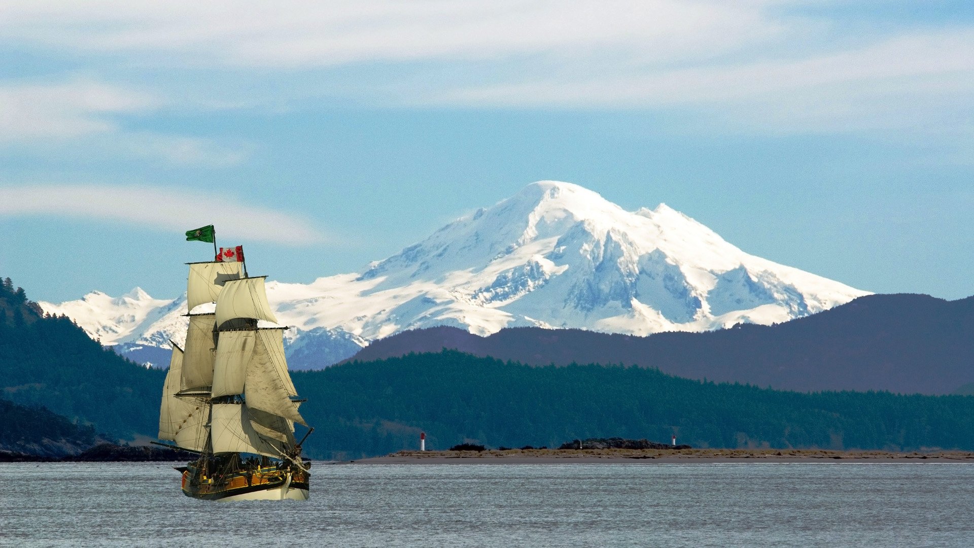 isola vancouver canada montagne neve cime fiume nave barca a vela bandiera