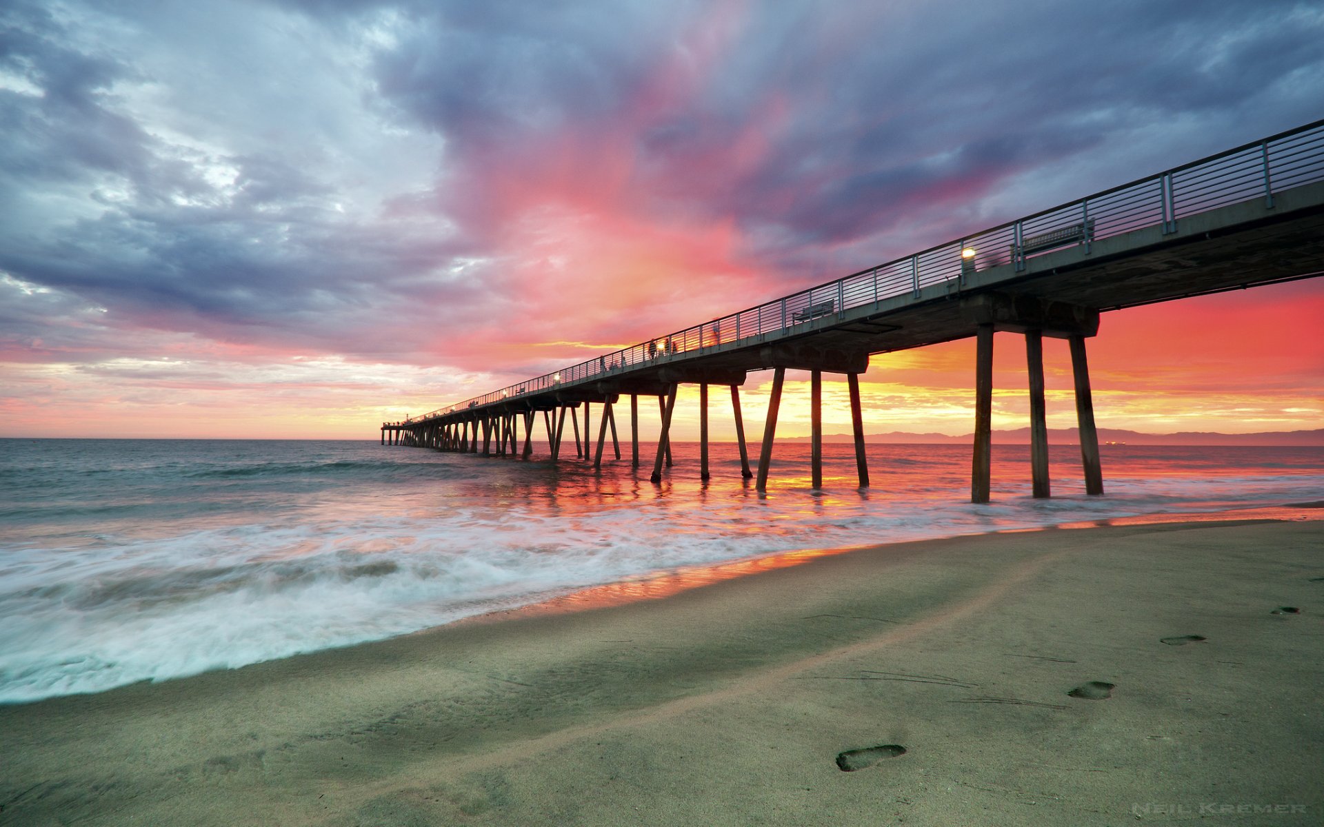 ea waves beach pier sunset