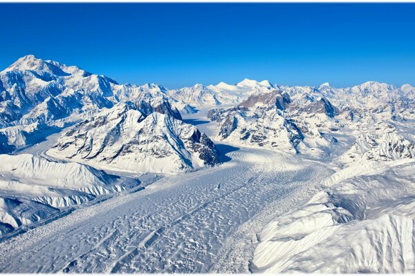 Winter road on the background of mountains