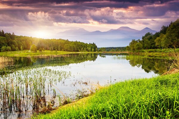 Mesmerizingly beautiful clouds and a wonderful landscape of a calm river