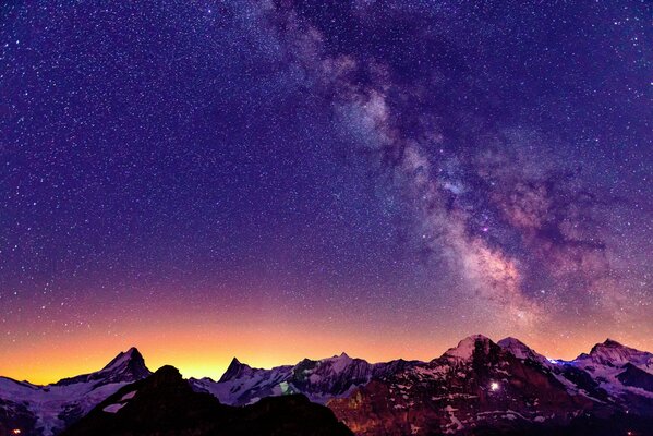 Sunset and star-studded sky in the Alps