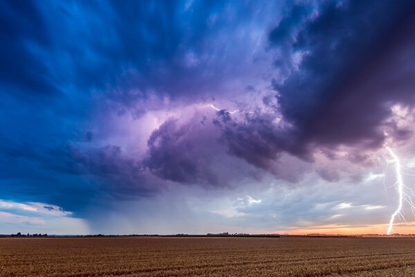 Thunderstorm and lightning over a deserted field