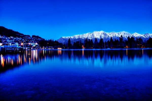 Reflection of urban twilight in the lake