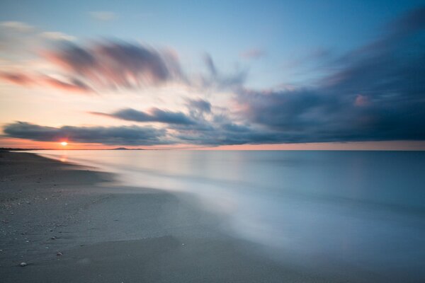 Seascape with clouds covering the sun