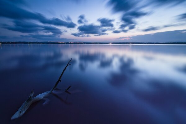 Reflection of dark clouds in the sea in the early morning