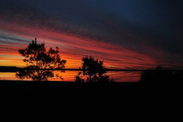 Beautiful sunset by the lake at dusk