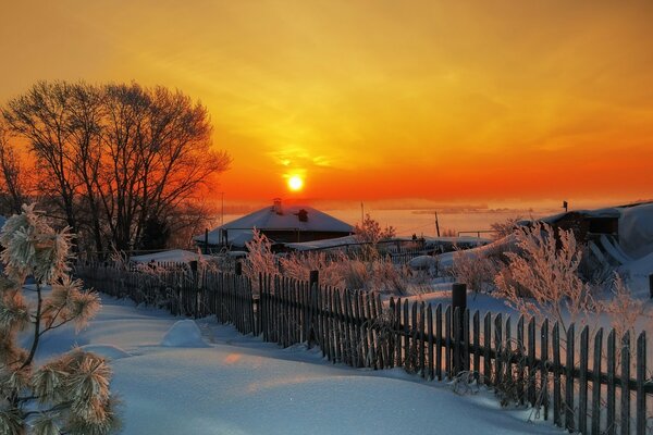 A village wrapped up in a winter sunset