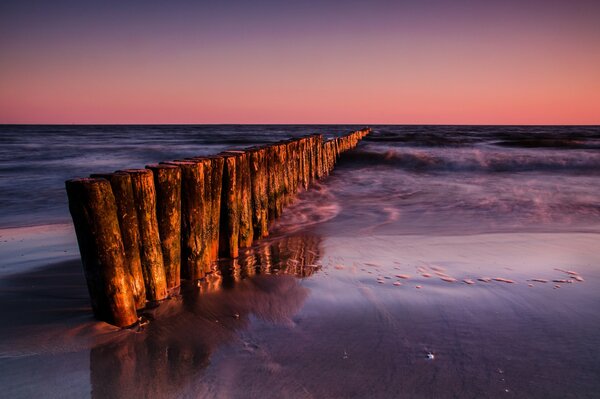 The dawn rocks of the raging sea