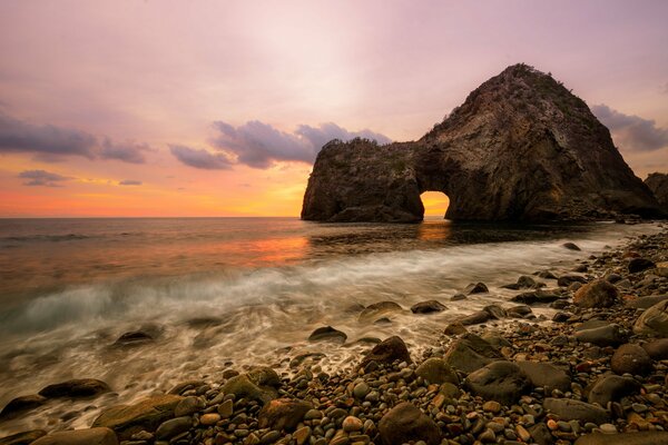 Rocky beach and white waves