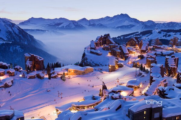 Tempting lights of a mountain resort town in winter