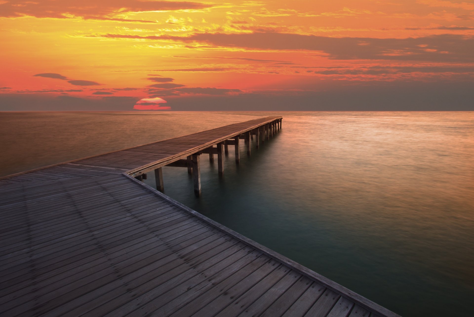 landscape sea river ocean water pier wharf sunset sun clouds sky background widescreen full screen hd wallpaper