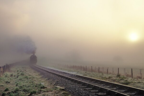 The locomotive is in the fog. Railway to Infinity