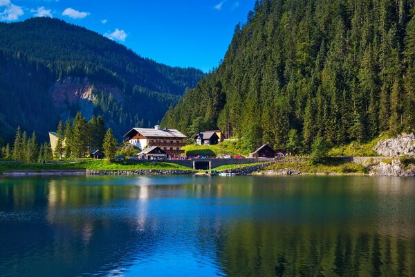 Mountain house on the lake shore