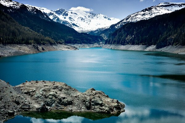 Blue-eyed lakes surrounded by snowy mountains