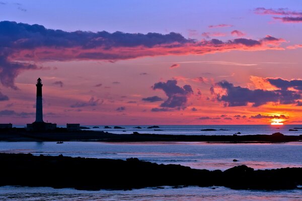 Landscape of the night sea with a lighthouse