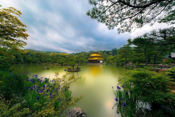 A temple in Japan on a lake in a park