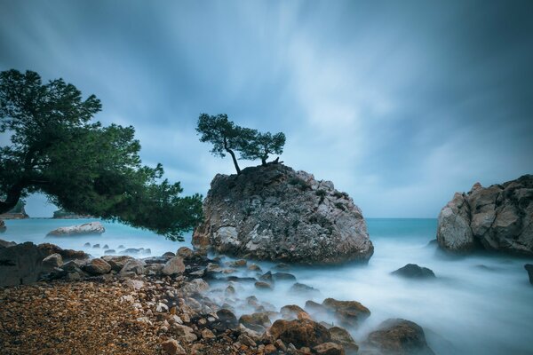 The rocky coast of France in the evening haze