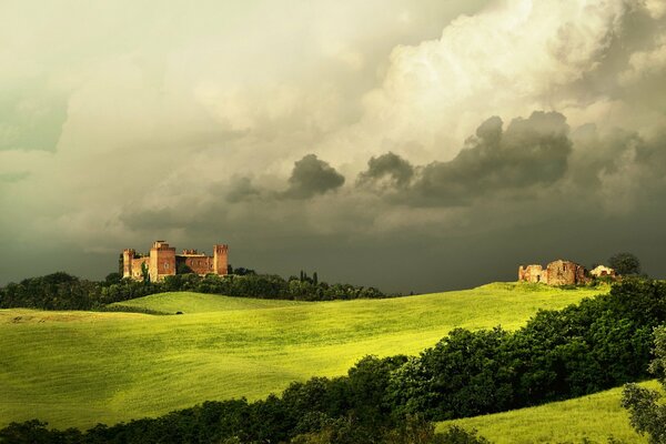 Tuscany in clouds and green grass