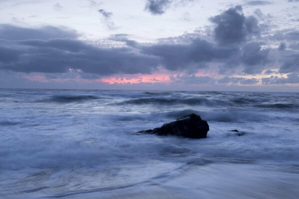 Sea surf and evening sunset