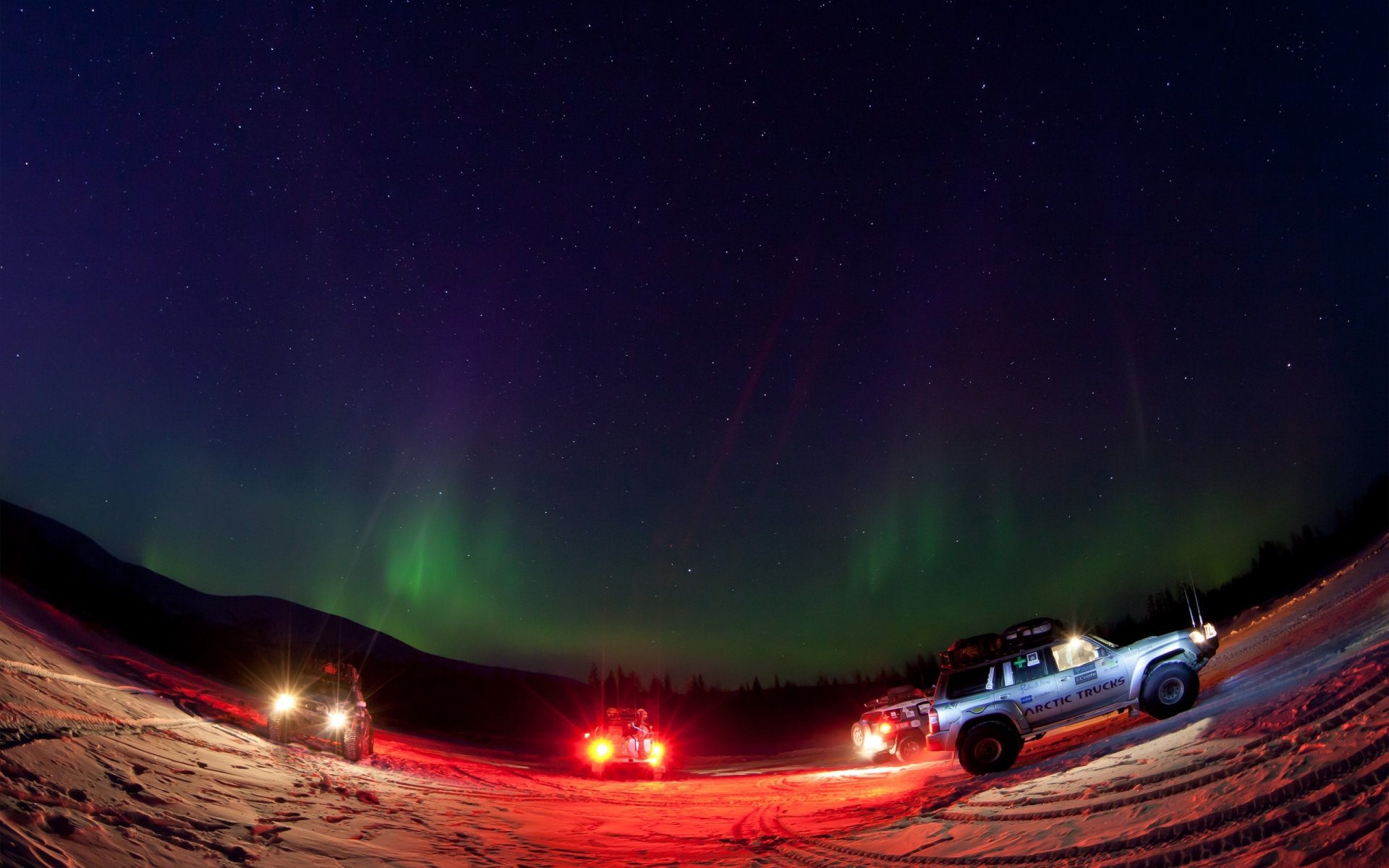 chukotka . northern lights night machinery headlight