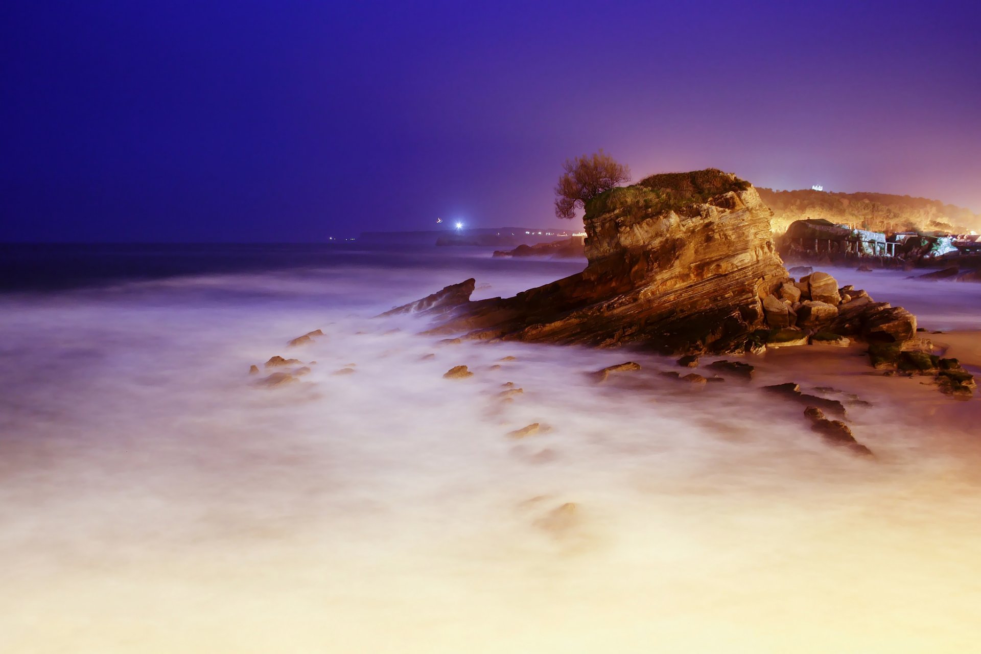 noche mar rocas exposición luz de fondo