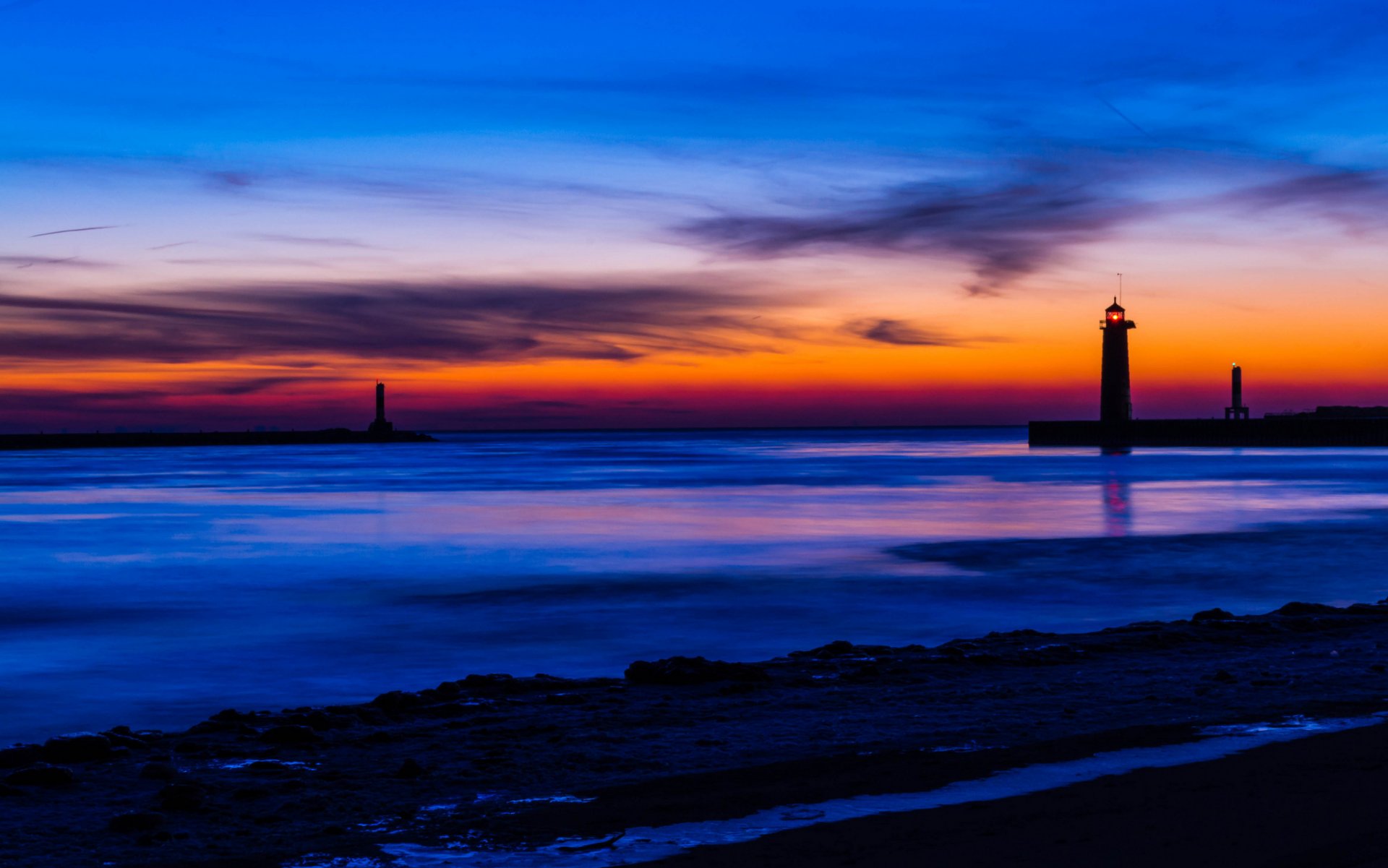 estados unidos michigan lago costa faro noche naranja puesta de sol azul cielo nubes