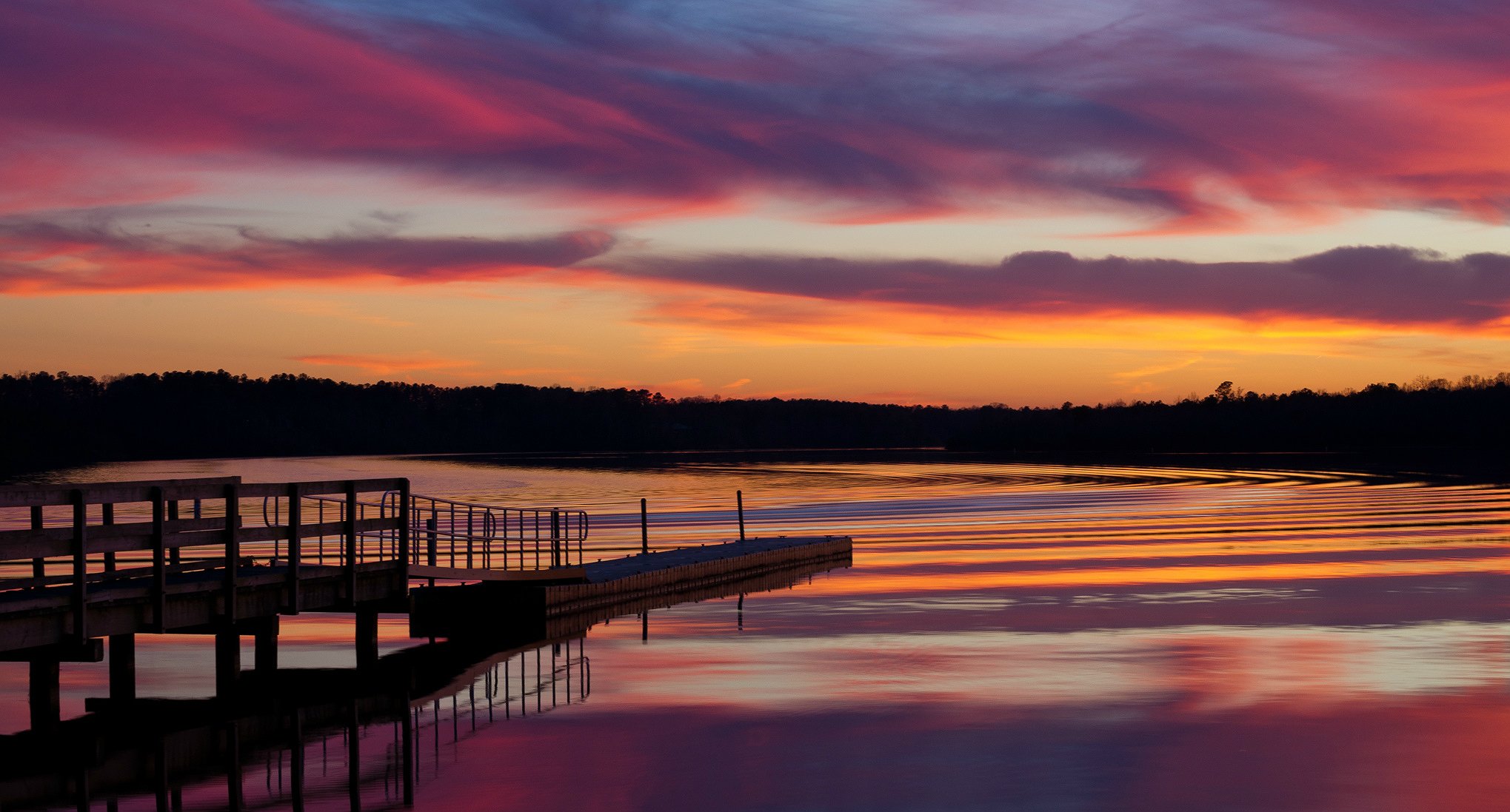 estados unidos lago puente árboles tarde puesta del sol cielo nubes reflexión