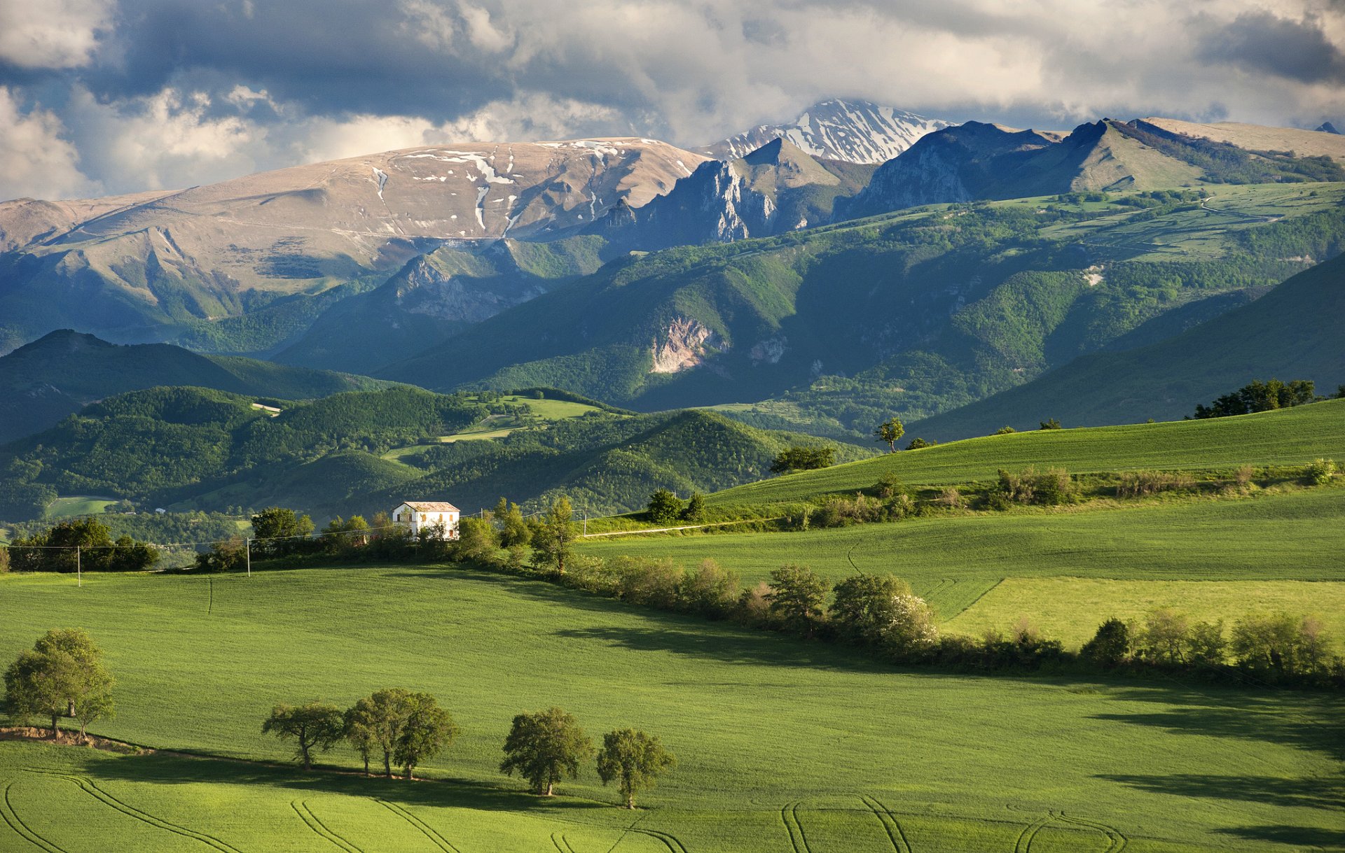 italy the field tree house mountain sky cloud