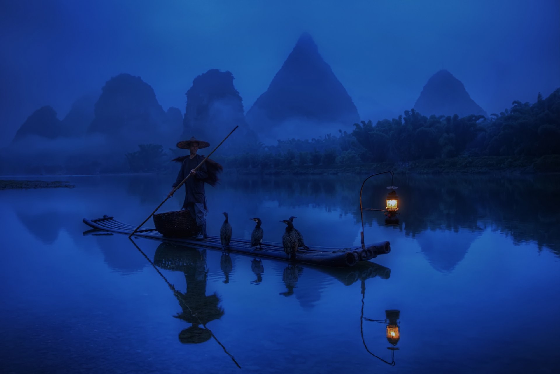 china morning fisherman boat lantern light cormorants river water forest reflection blue background