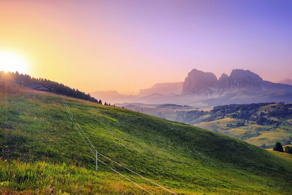 Landscape from the window to the field and sunset