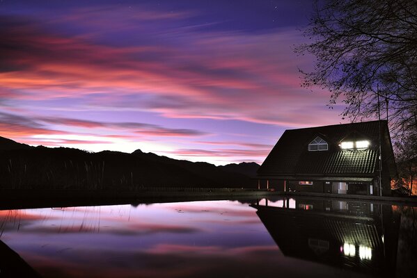 The house on the lake. Night sky