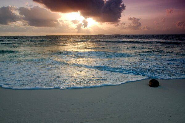 Sea beach at sunset with clouds